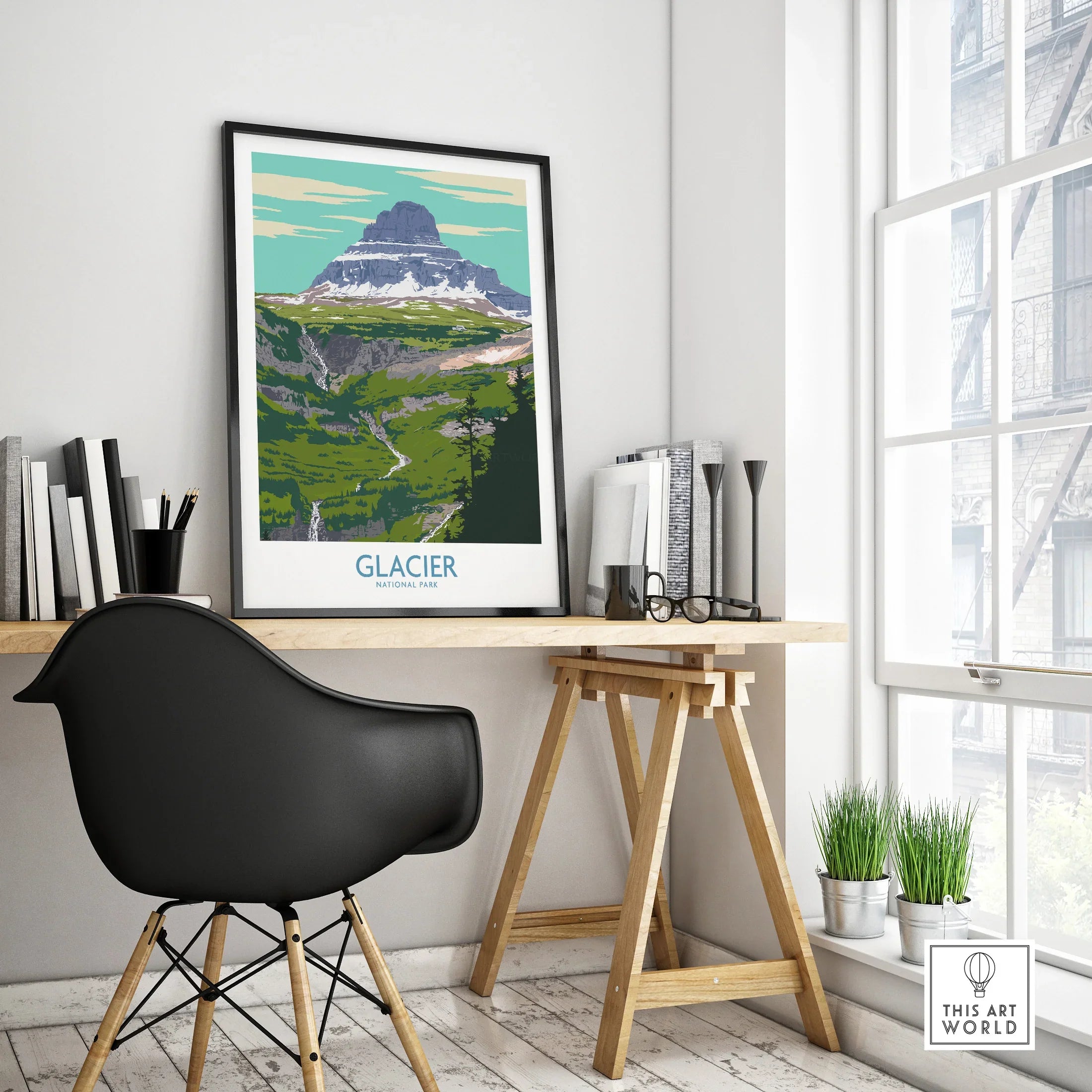 Glacier National Park travel poster in black frame on modern office desk