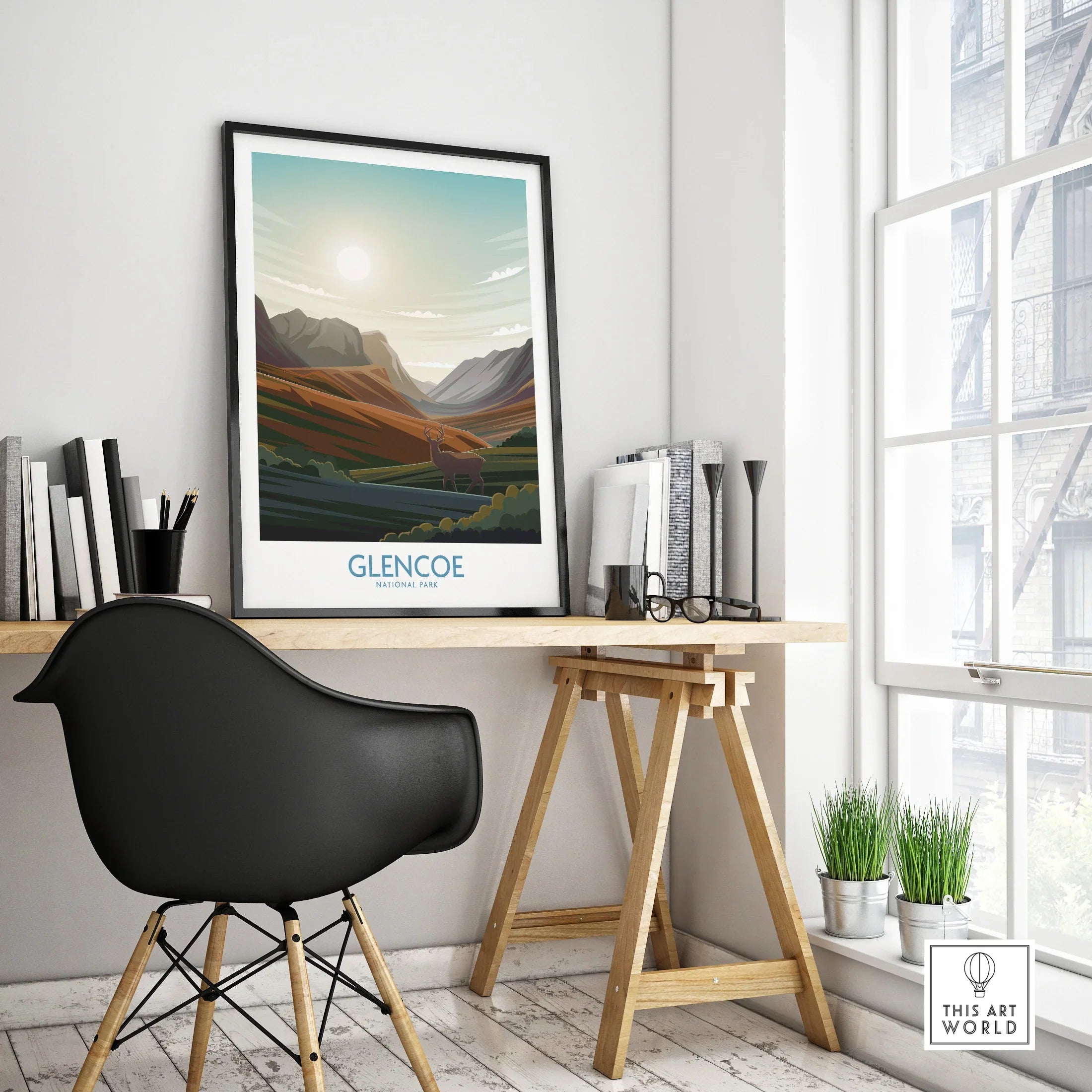 Framed Glencoe National Park travel poster on modern office desk by a window
