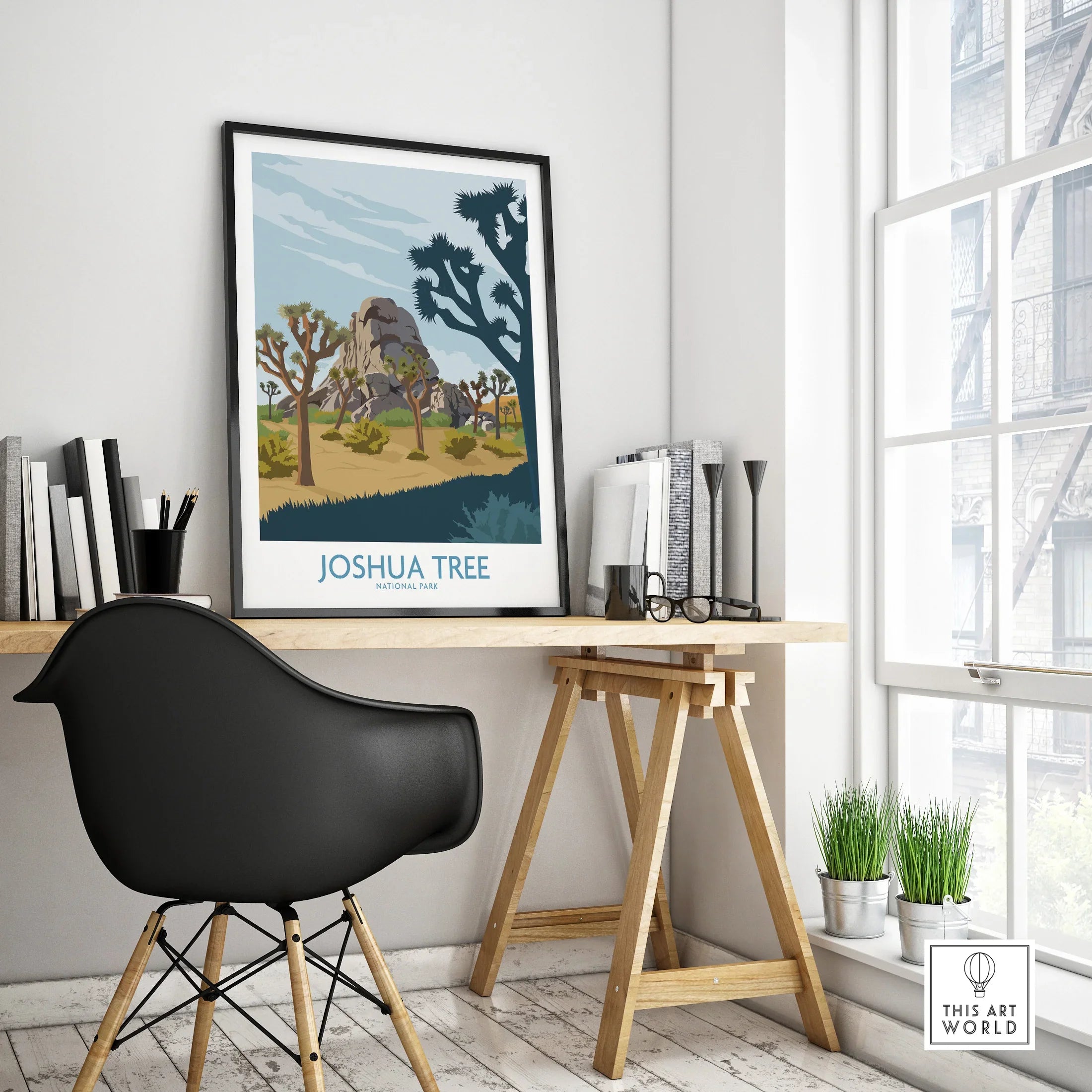 Framed Joshua Tree National Park travel poster on modern office desk with decor