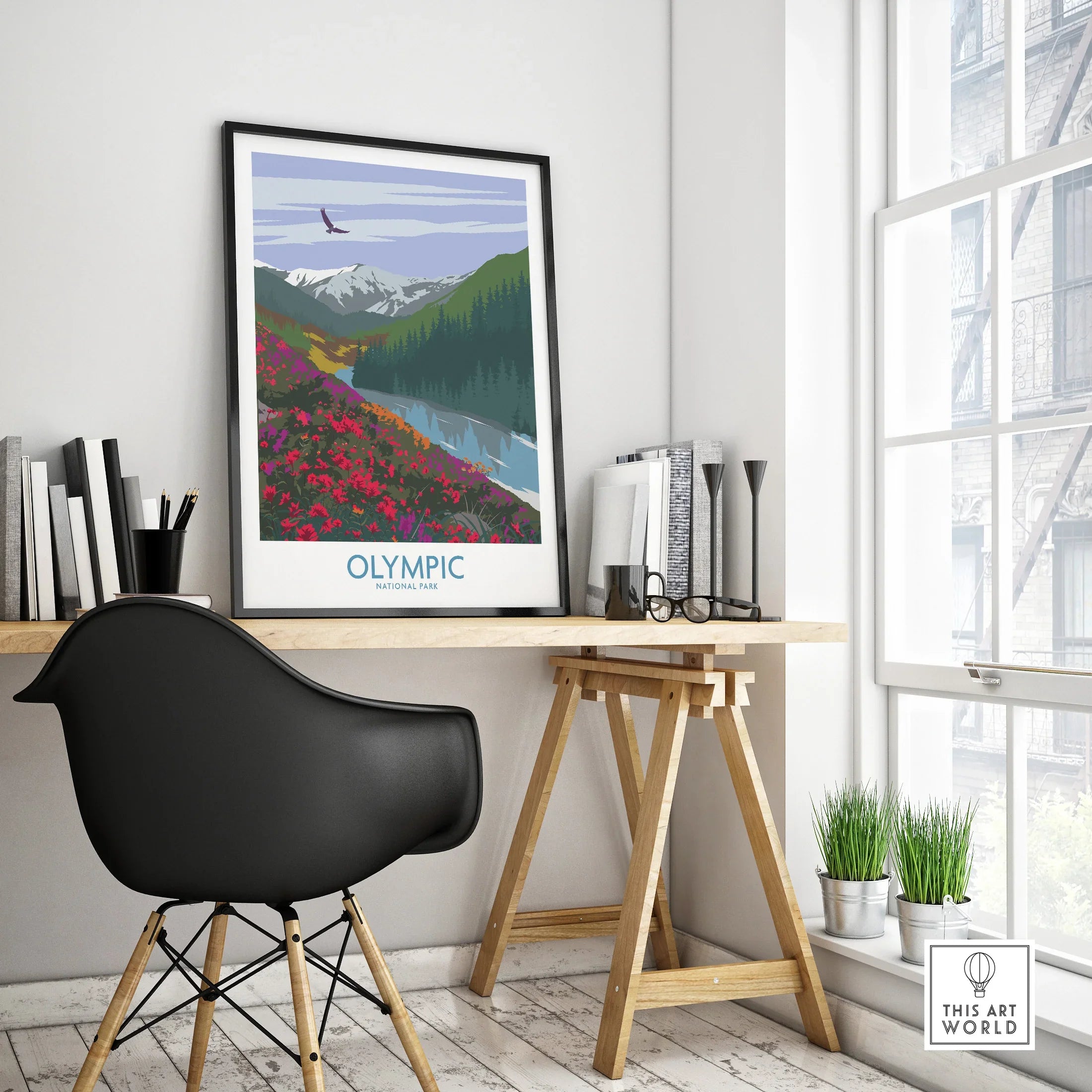 Olympic National Park travel poster in black frame on modern office desk with decorative plants