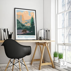 Rocky Mountains Colorado travel poster with bear, framed on modern office desk