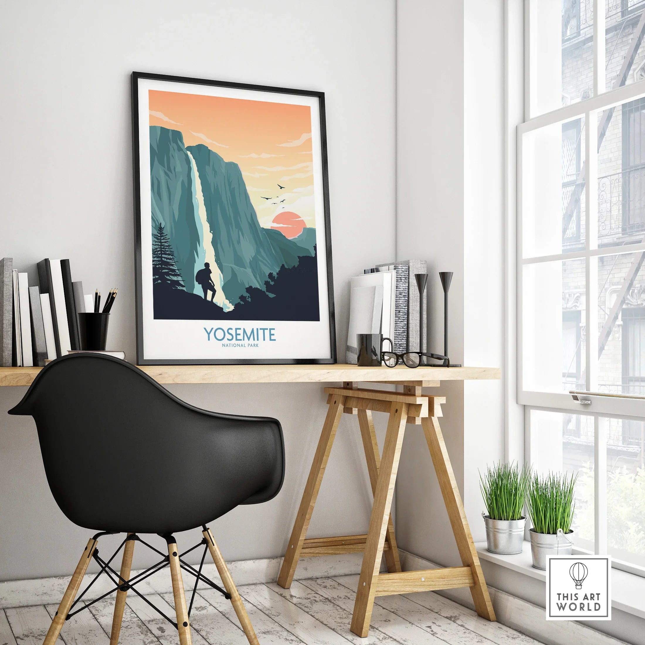 Framed Yosemite National Park travel poster on modern home office desk with black chair