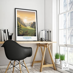 Framed Yosemite National Park travel poster on modern home office desk with black chair.