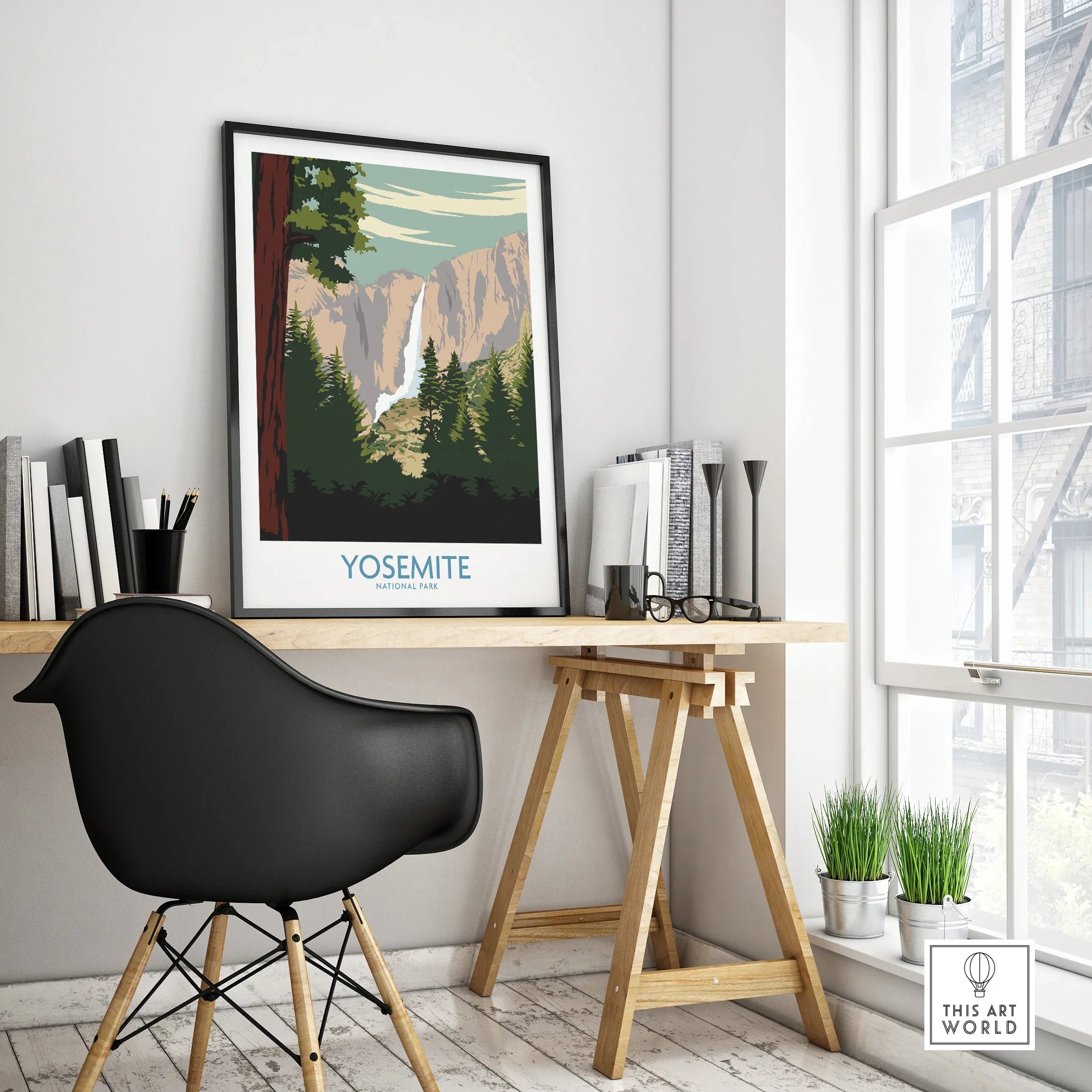 Framed Yosemite National Park travel poster on modern office desk by window