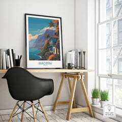 Framed Madeira Portugal travel poster on modern office desk with black chair and decor