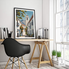 Mijas Spain Travel Poster | Traditional White Street Wall Art Print displayed in a modern workspace with a stylish chair.