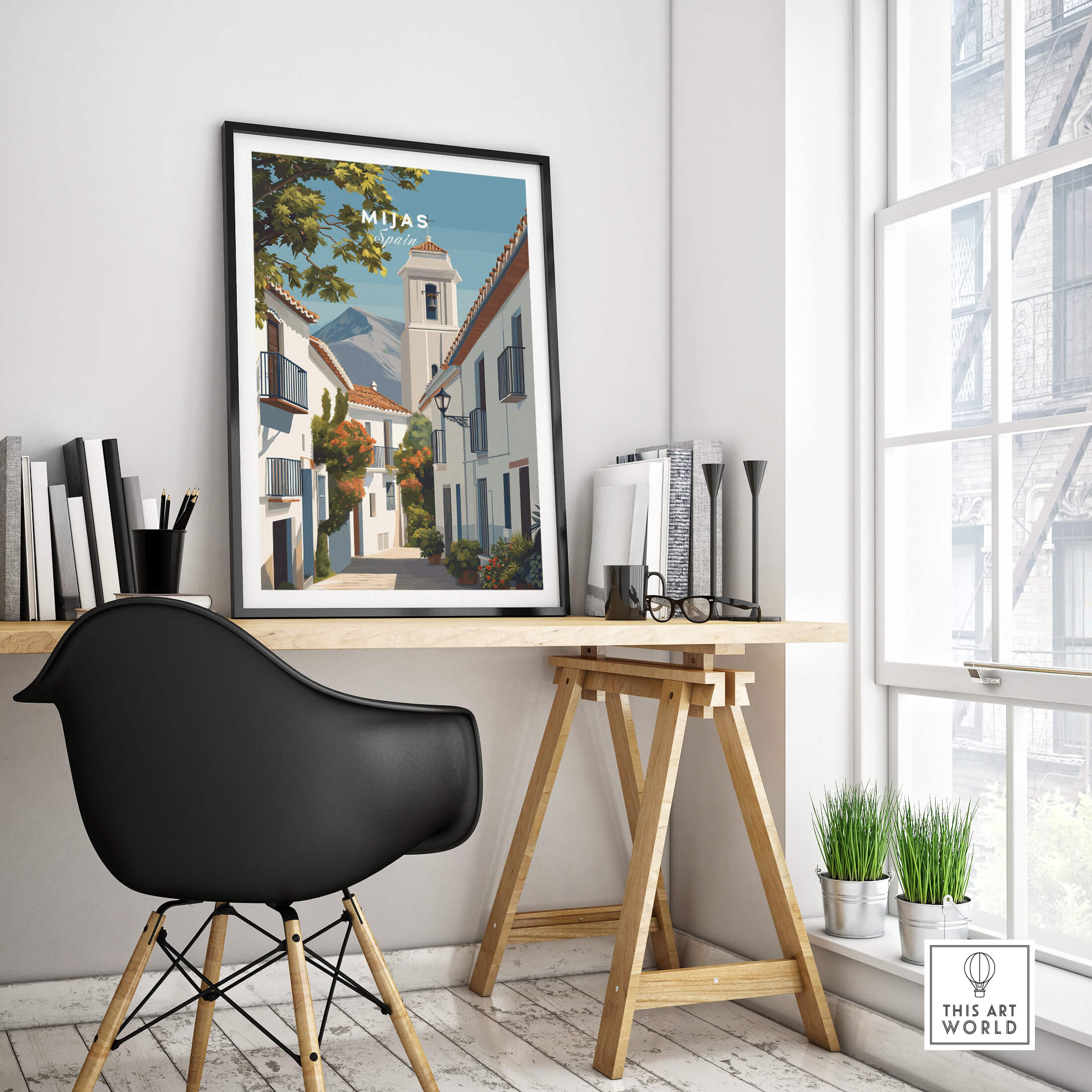 Mijas Spain Travel Poster | Traditional White Street Wall Art Print displayed in a modern workspace with a stylish chair.