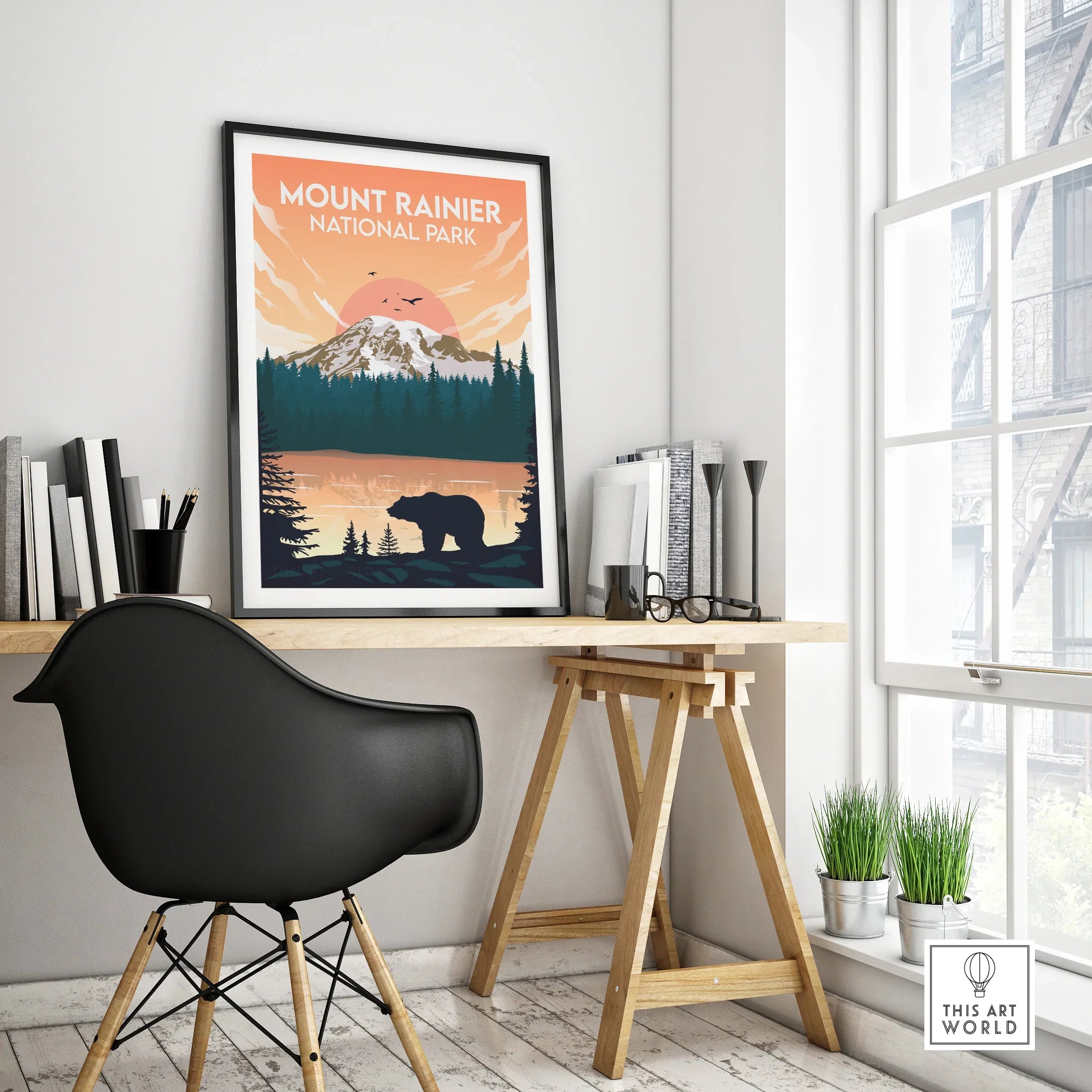 Framed Mount Rainier National Park travel poster on modern office desk, bear and mountain art