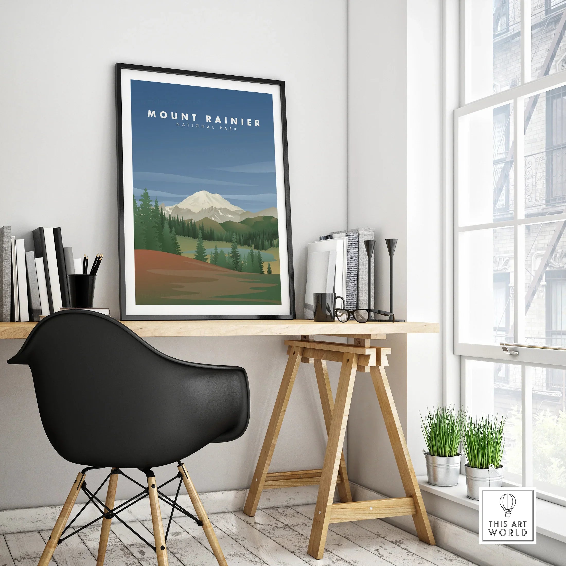 Framed Mount Rainier National Park travel poster on modern office desk by window