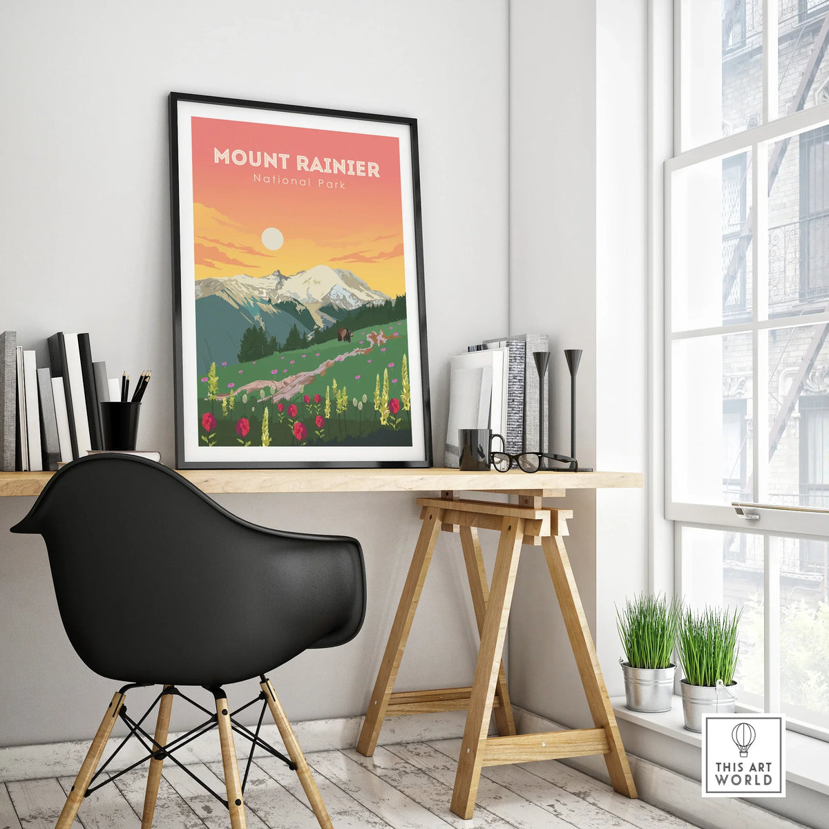 Mount Rainier National Park travel poster in black frame on modern office desk