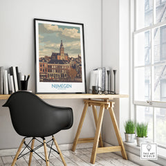 Nijmegen city skyline travel poster in black frame on modern office desk by window