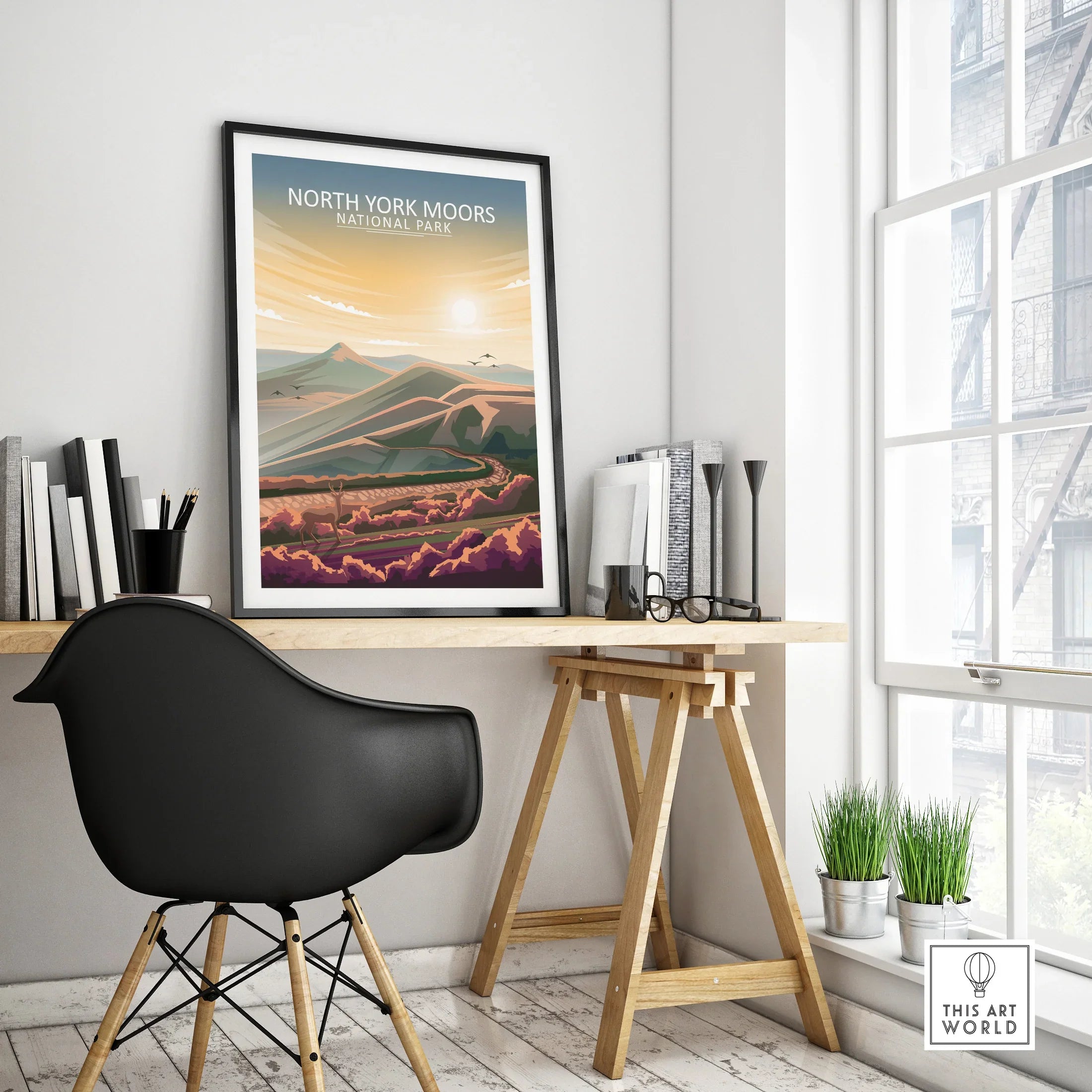 Framed North York Moors National Park travel poster on modern office desk in bright room