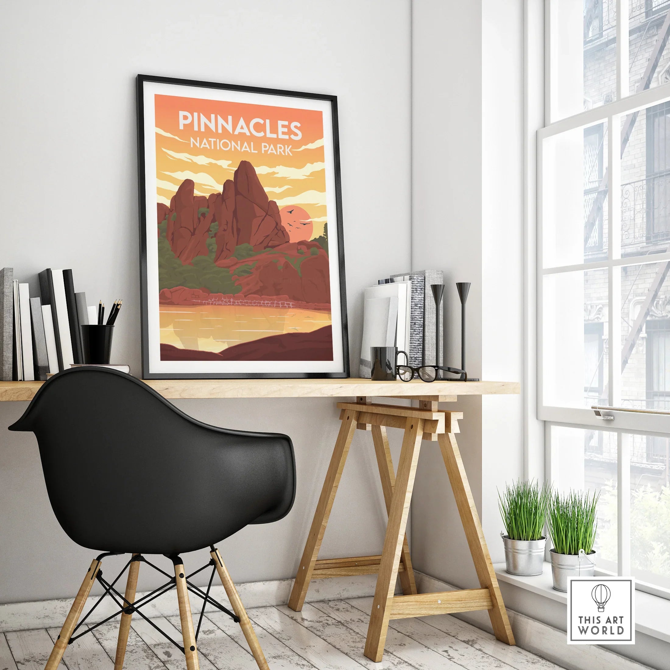 Pinnacles National Park travel poster in black frame on modern office desk setup