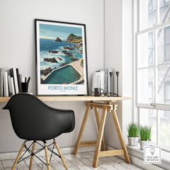 Porto Moniz travel poster with ocean view in black frame on modern office desk