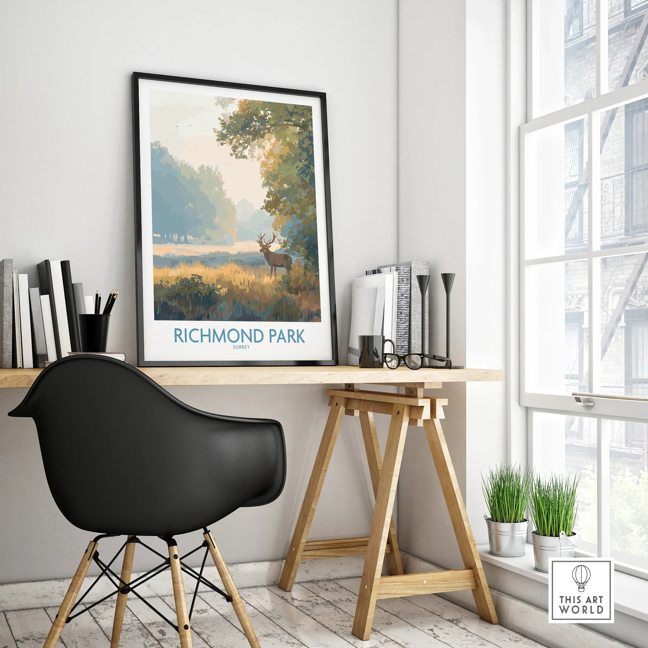 Framed Richmond Park travel poster on modern office desk in bright room