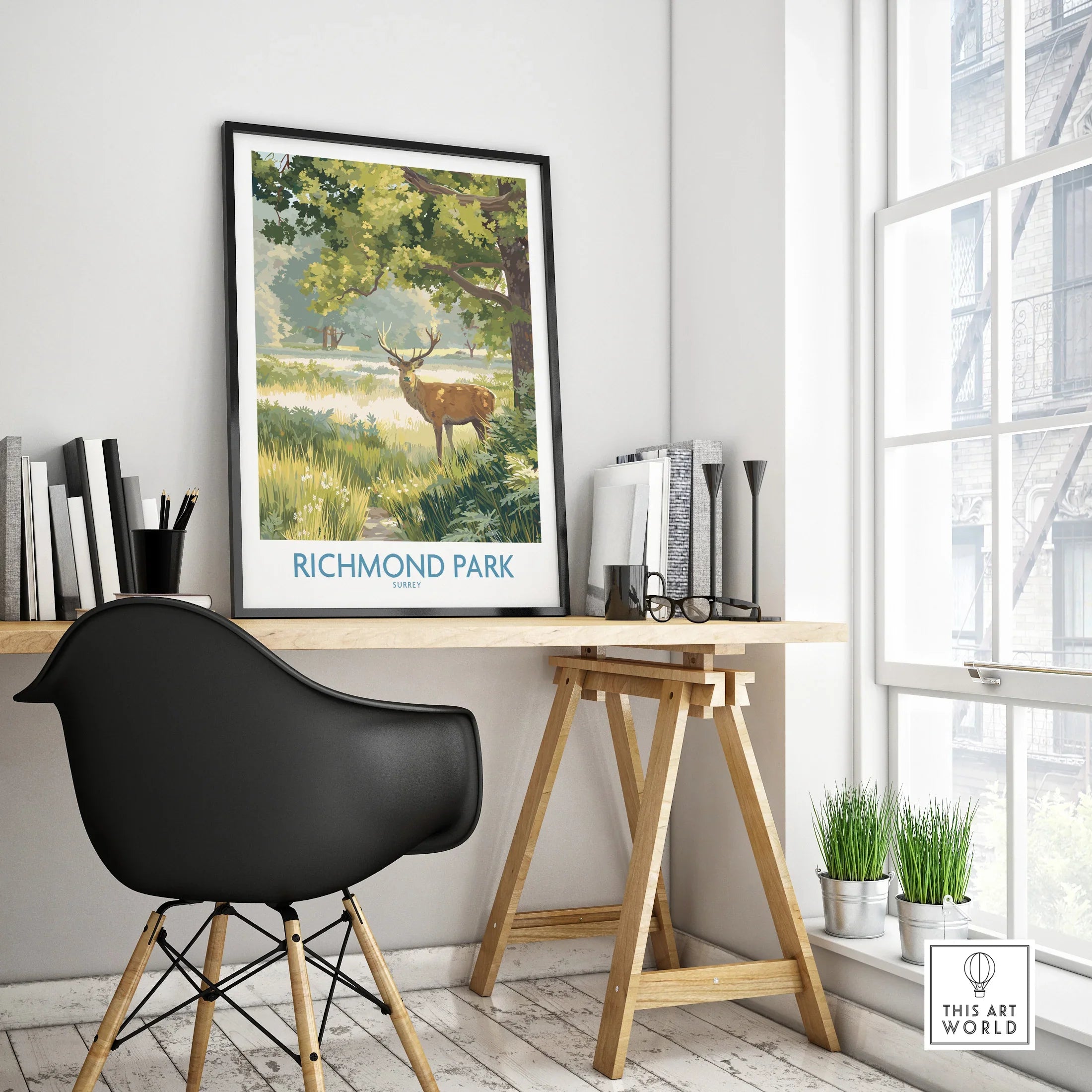 Richmond Park travel poster with deer, framed on desk in modern home office decor