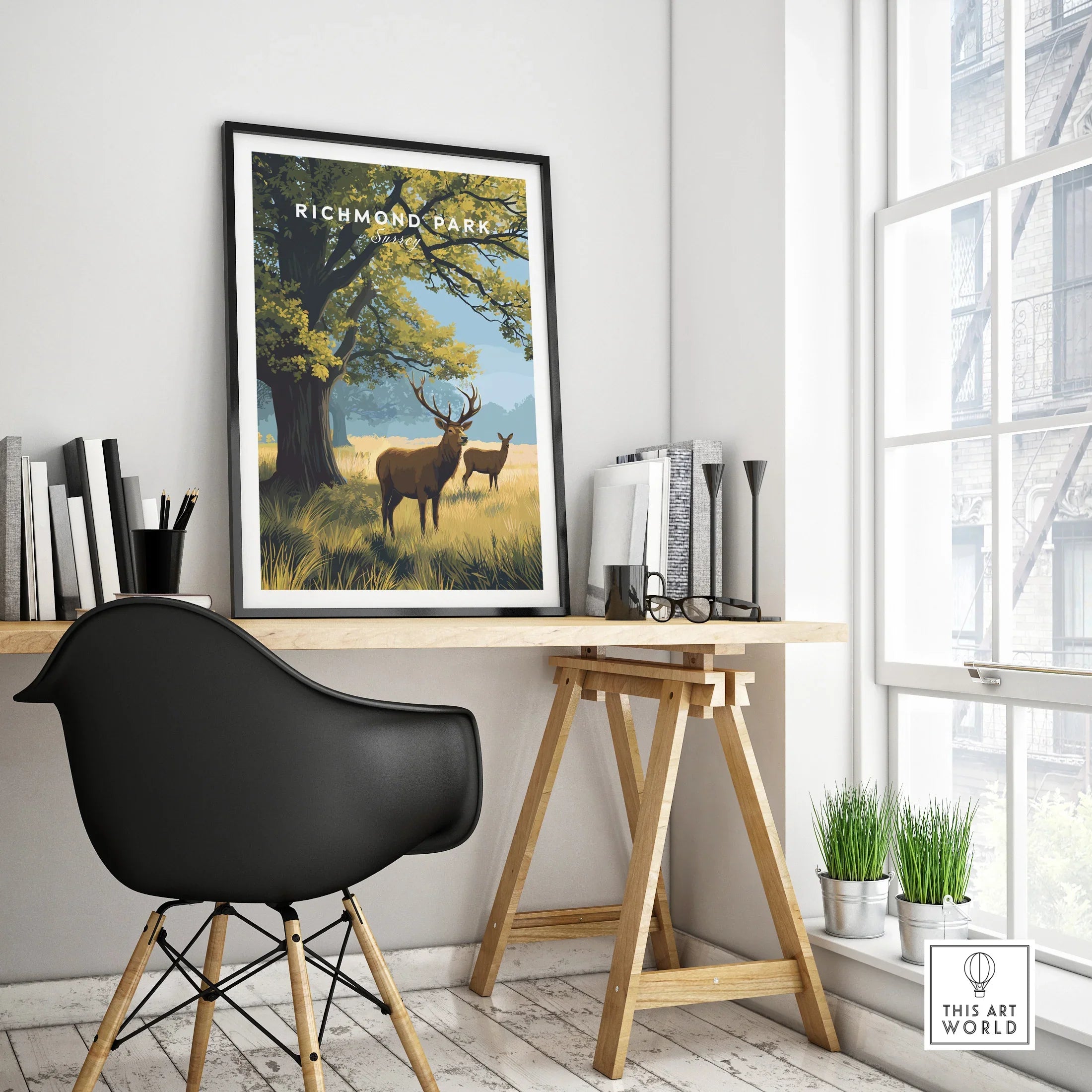 Richmond Park framed travel poster with deer on modern home office desk by window