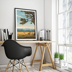 Framed Richmond Park travel poster on modern office desk with black chair and decor.