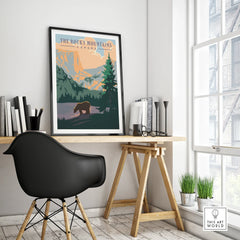 Rocky Mountains Canada travel poster in black frame on modern office desk, minimalist decor