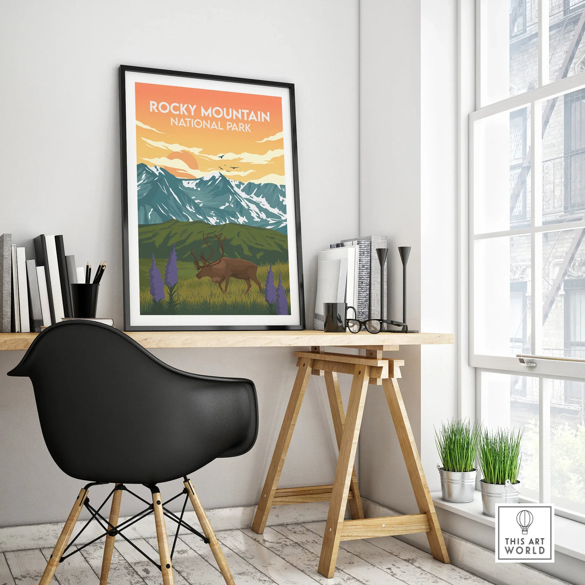 Rocky Mountain National Park travel poster in black frame on modern office desk