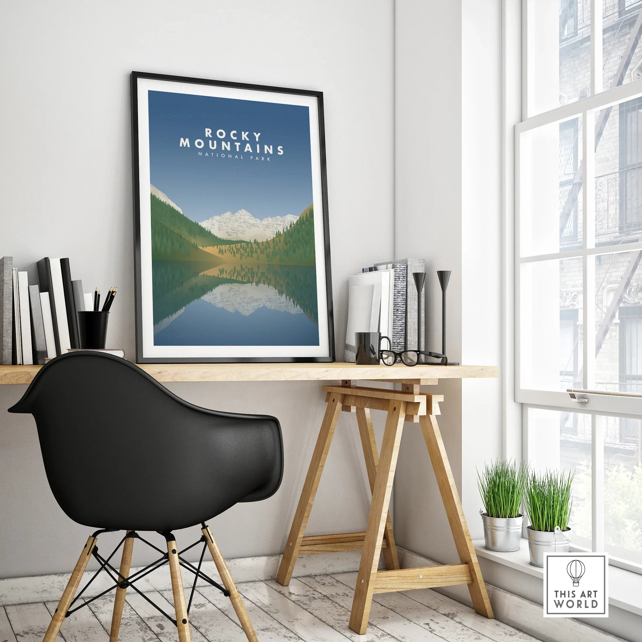Framed Rocky Mountains National Park travel poster on modern office desk, minimalist decor