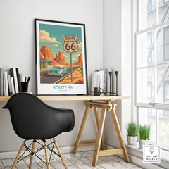 Modern office desk with framed Route 66 travel poster and black chair by window