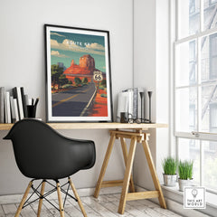 Route 66 travel poster in black frame on modern office desk with chair and decor