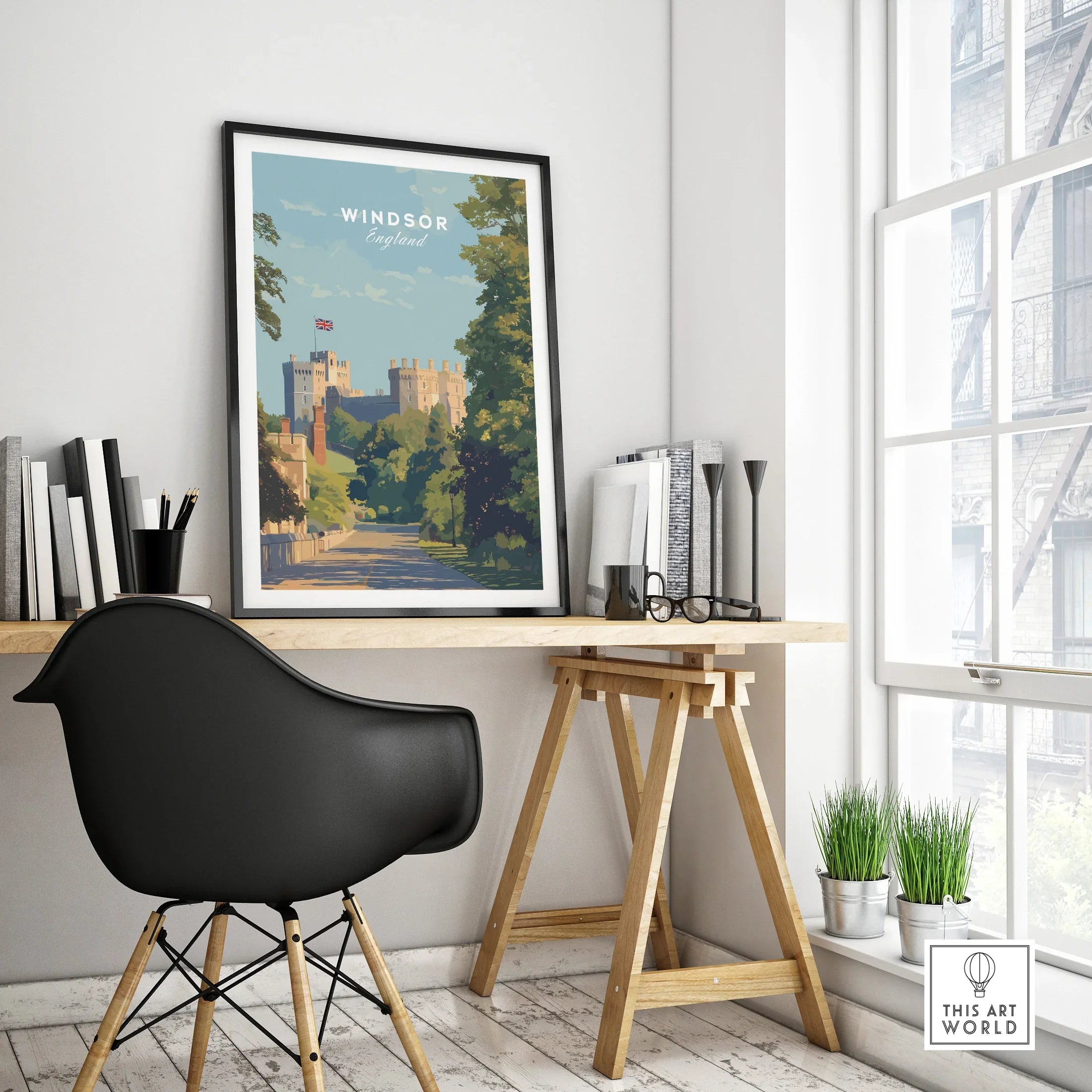 Windsor England travel poster in black frame on modern office desk near window
