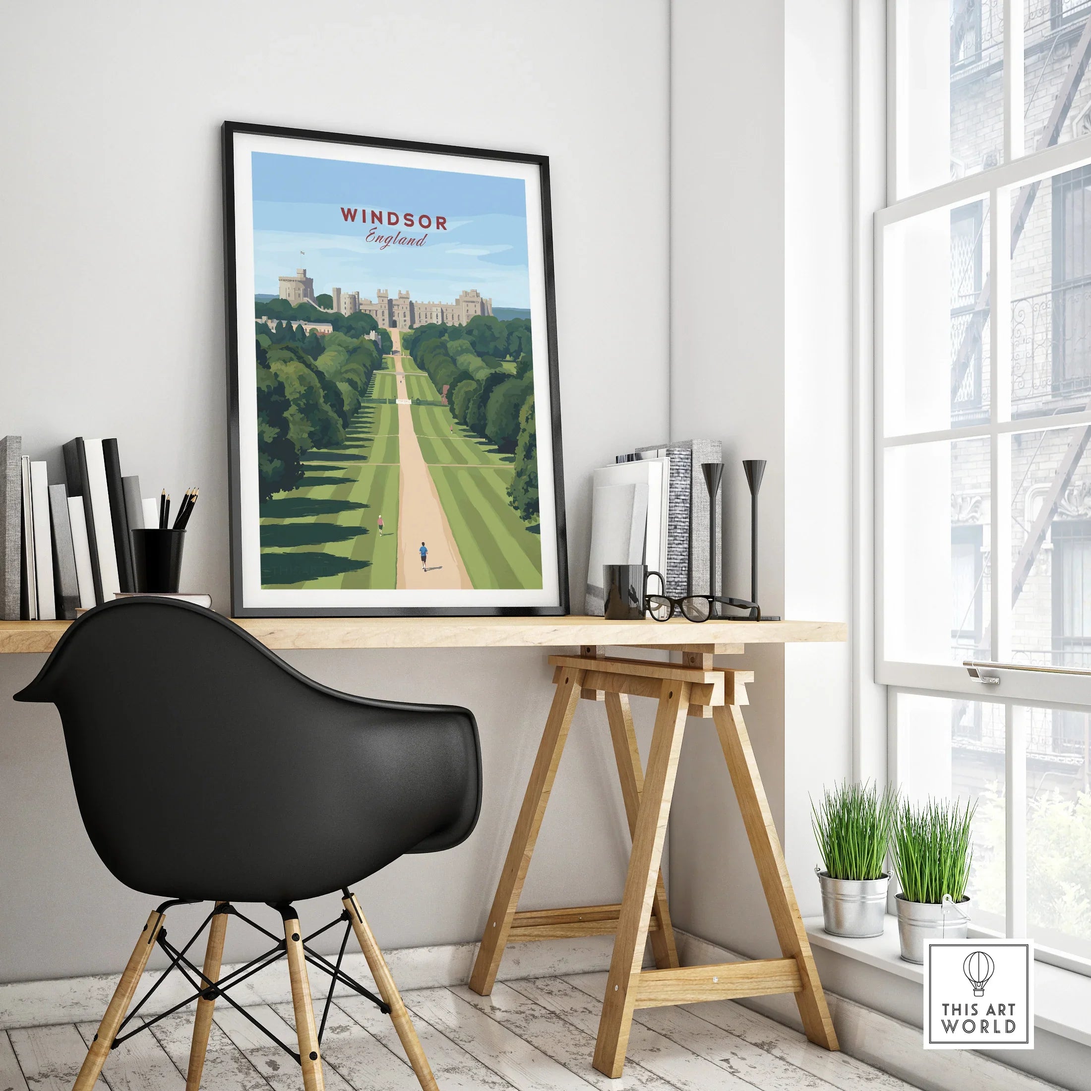 Framed Windsor England travel poster on modern office desk with black chair