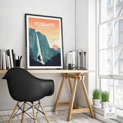 Yosemite National Park travel poster with waterfall in black frame on modern office desk
