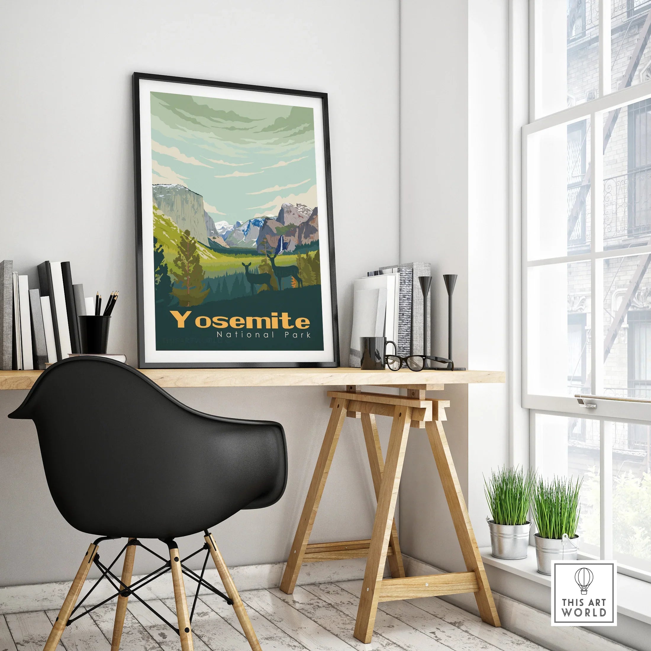 Framed Yosemite National Park travel poster on modern office desk with black chair
