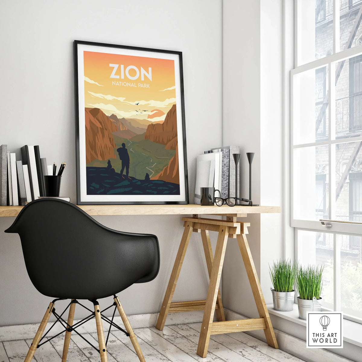 Framed Zion National Park travel poster on modern office desk with black chair