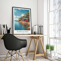 Åland Islands Lakeside Cabin Art Print | Finland Rustic Landscape Poster displayed in a cozy workspace.