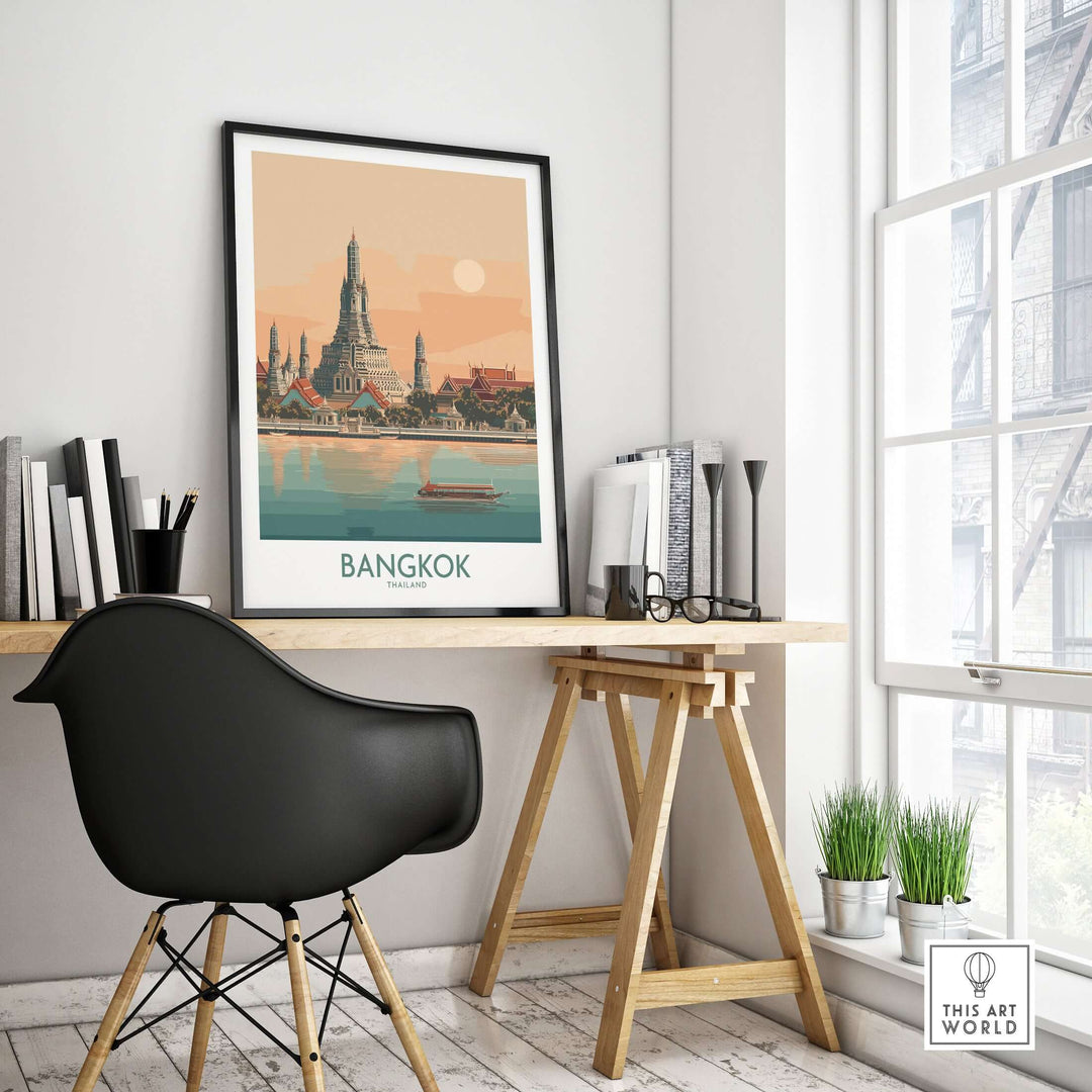 Poster of Bangkok's Temple of Dawn displayed in a modern workspace, showcasing Thai architectural elegance.