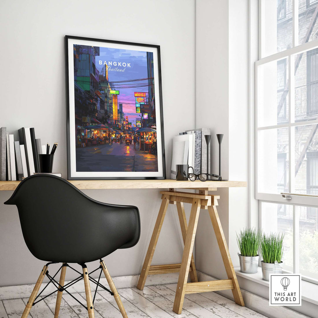 Bangkok Thailand night market print displayed in a modern workspace with a stylish black chair and greenery.