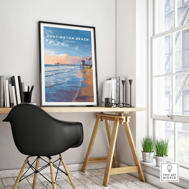 Huntington Beach Pier at Sunset poster displayed in a stylish coastal-themed workspace.