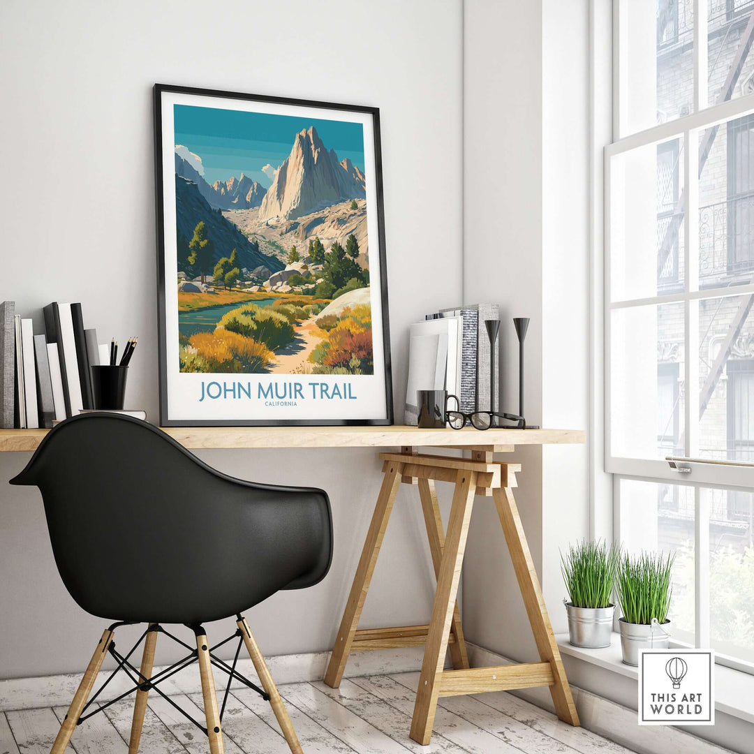 John Muir Trail poster displayed on a desk in a bright room, showcasing Yosemite National Park's stunning alpine landscape.