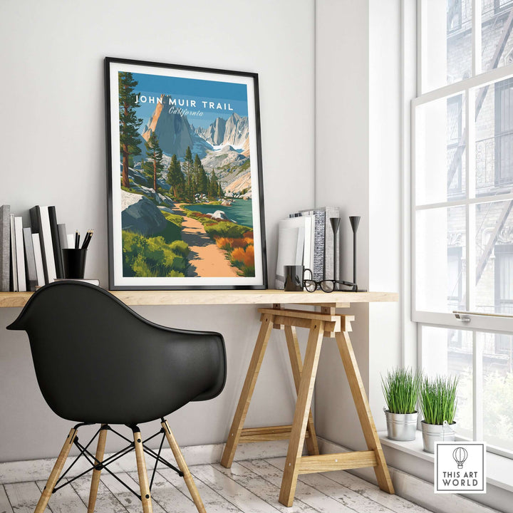 John Muir Trail poster featuring lakeside scenery and mountains, displayed in a modern office setting.