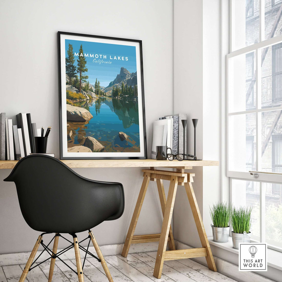 Mammoth Lakes California poster displayed in a modern workspace with a view of serene mountain landscape and a stylish chair.