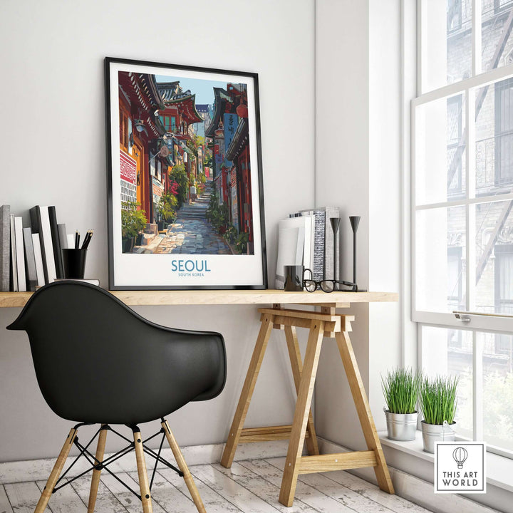 Seoul Bukchon Hanok Village poster displayed in a stylish workspace, featuring traditional Korean architecture and vibrant colors.
