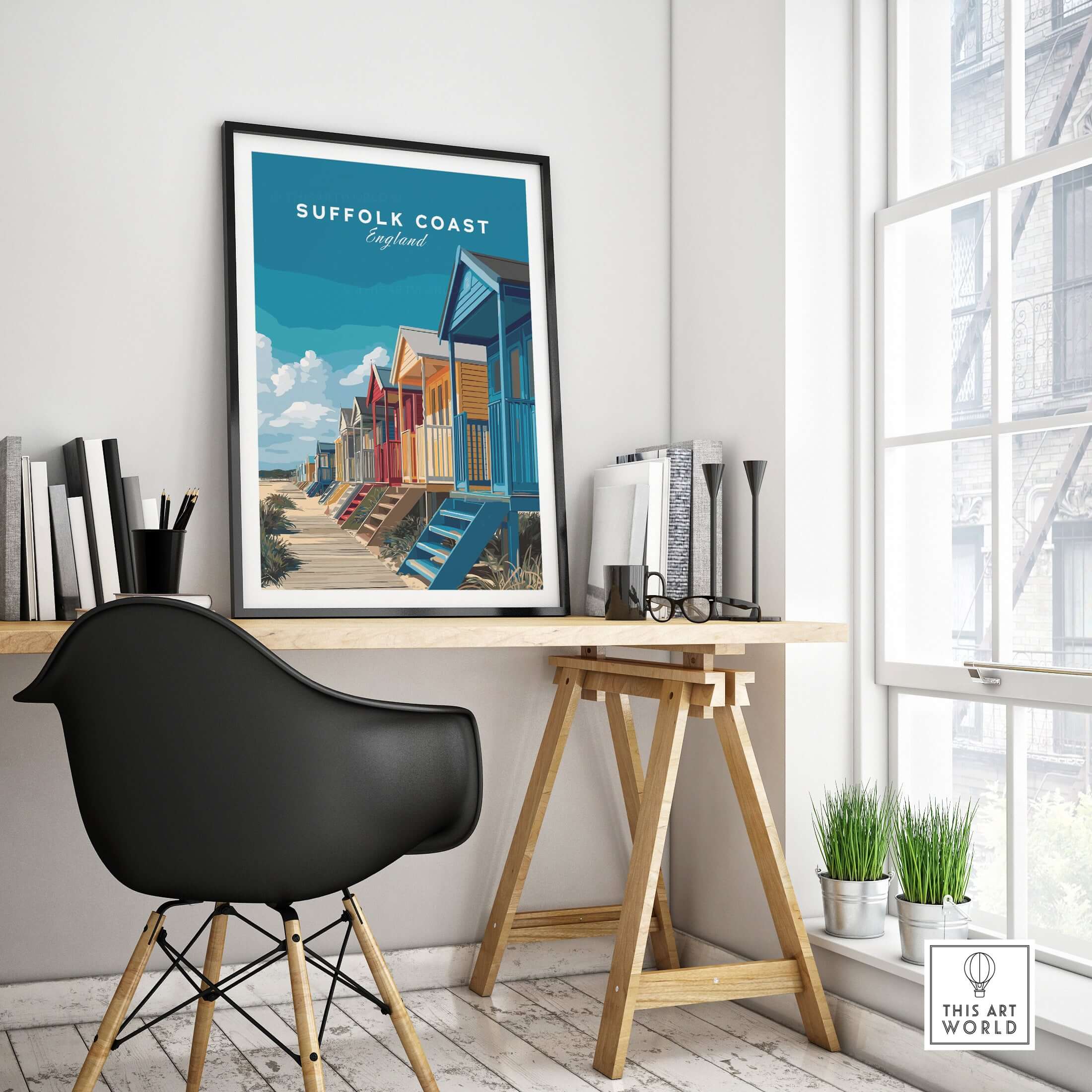 Suffolk Coast England Colorful Beach Huts Print - Vibrant Seaside Wall Art displayed in a modern interior with desk and chair.