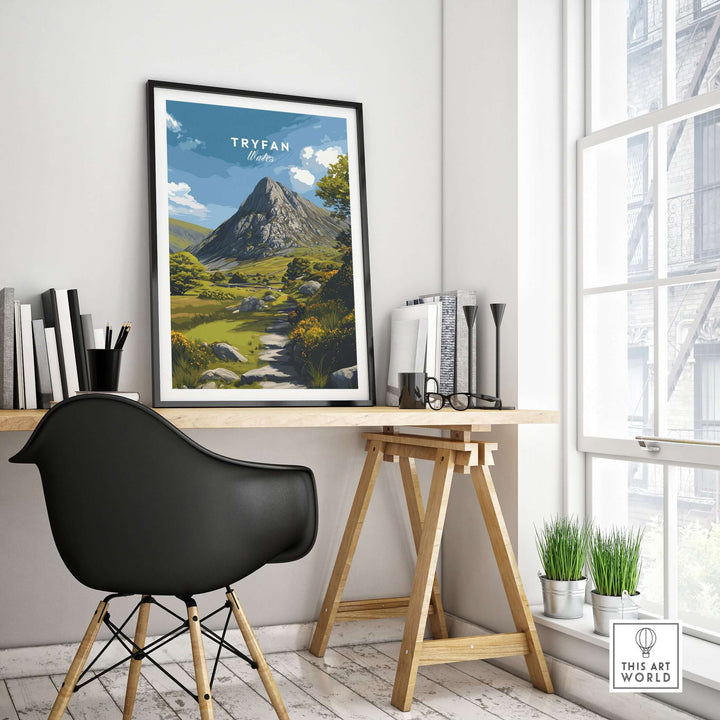 Tryfan poster showcasing Welsh Highlands art, featuring rugged mountains and a tranquil landscape in a modern workspace.