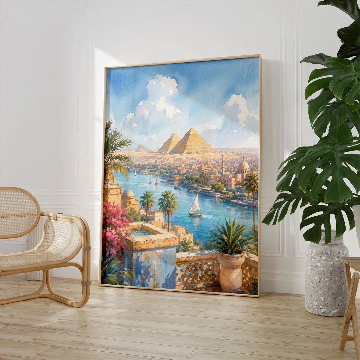 Cairo Pyramids of Giza and the Nile watercolour art print large framed print beside a chair and plant
