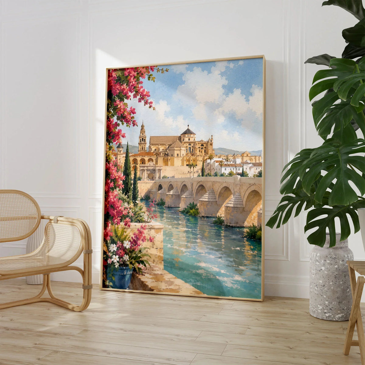 Córdoba Roman bridge and Mezquita watercolour art print large framed print beside a chair and plant