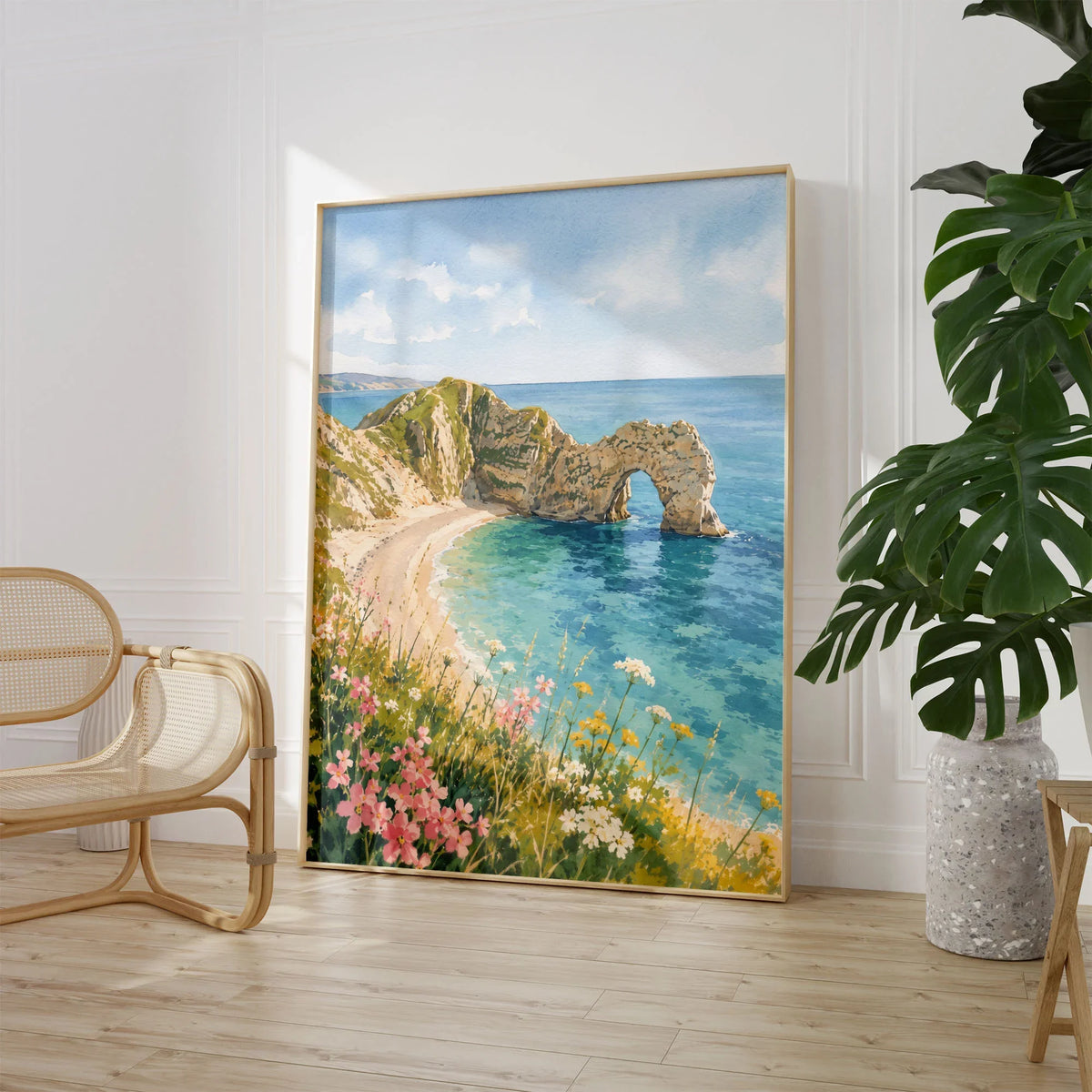 Dorset Durdle Door arch and beach watercolour art print large framed print beside a chair and plant