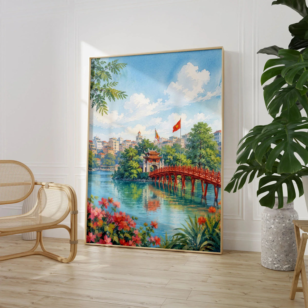 Hanoi red Huc Bridge on Hoan Kiem Lake watercolour art print large framed print beside a chair and plant