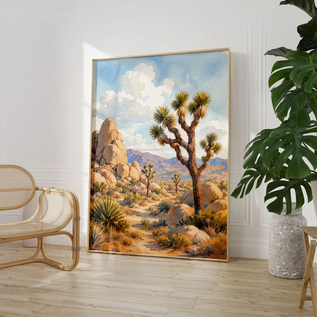 Joshua Tree National Park Joshua trees and granite boulders watercolour art print large framed print beside a chair and plant