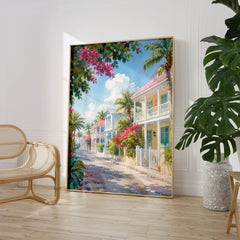 Key West pastel conch houses watercolour art print large framed print beside a chair and plant