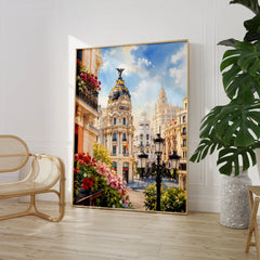Madrid Metropolis building on Gran Vía watercolour art print large framed print beside a chair and plant