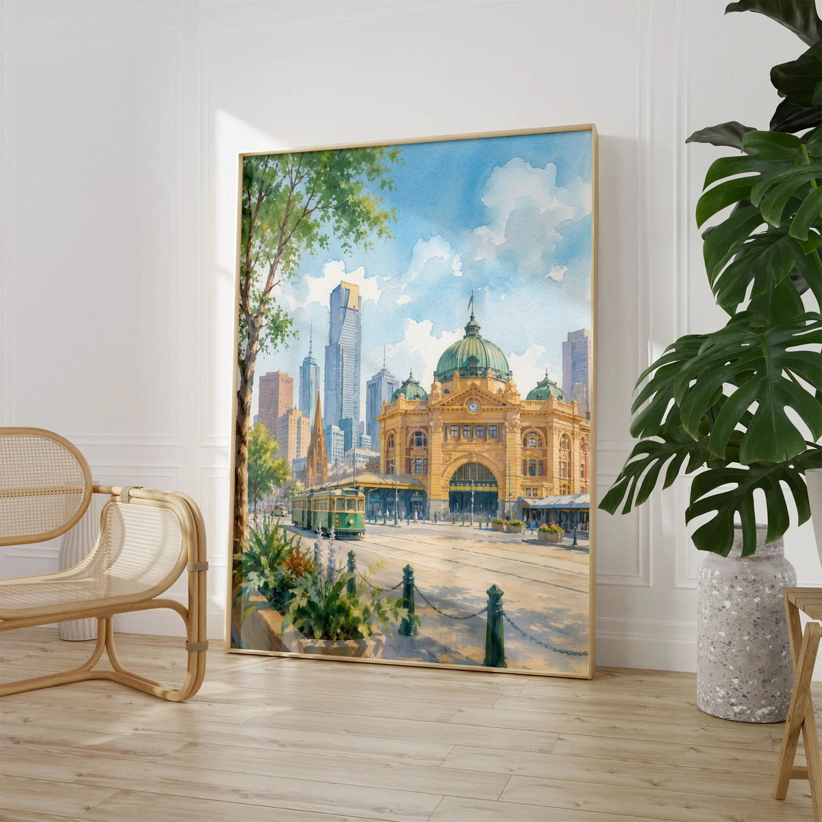 Melbourne Flinders Street Station and tram watercolour art print large framed print beside a chair and plant